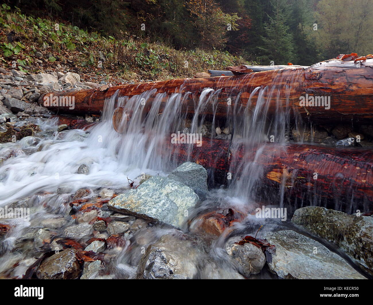 Wooden dam on a mountain river, Traditional structure for floating