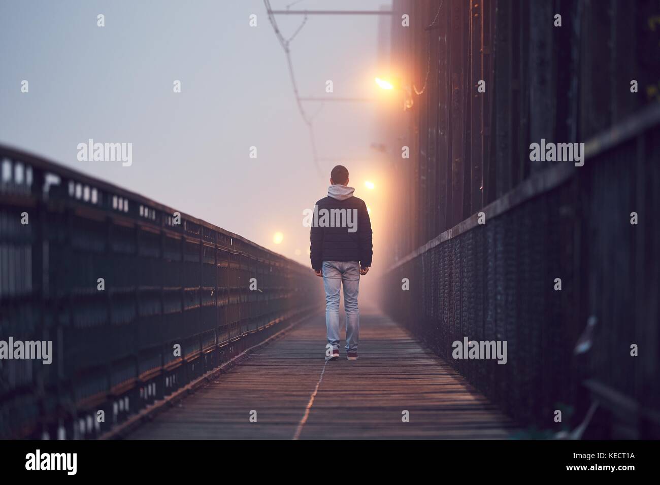pic Alone Sad Lonely Man Images https www alamy com stock image gloomy weather lonely man is walking on the old bridge in mysterious 163780774 html