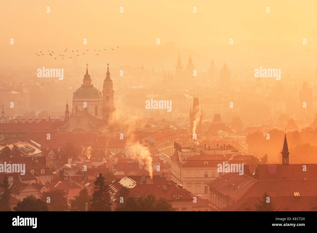 Foggy morning in the city. Prague Skyline at the sunrise. Stock Photo