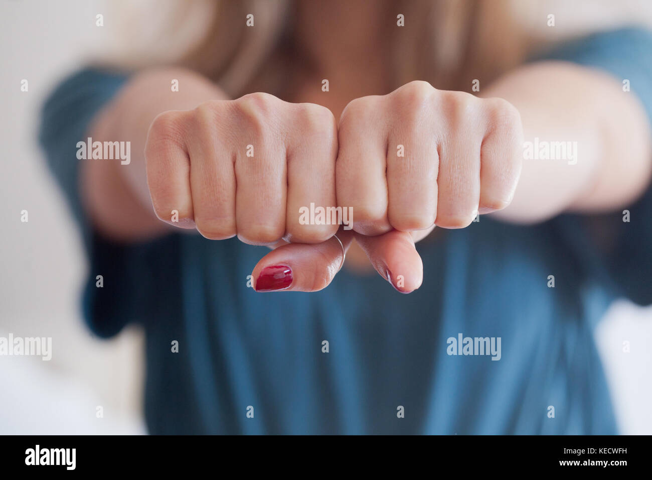 woman give a double punch, protecting herself. boxe fist. concept of