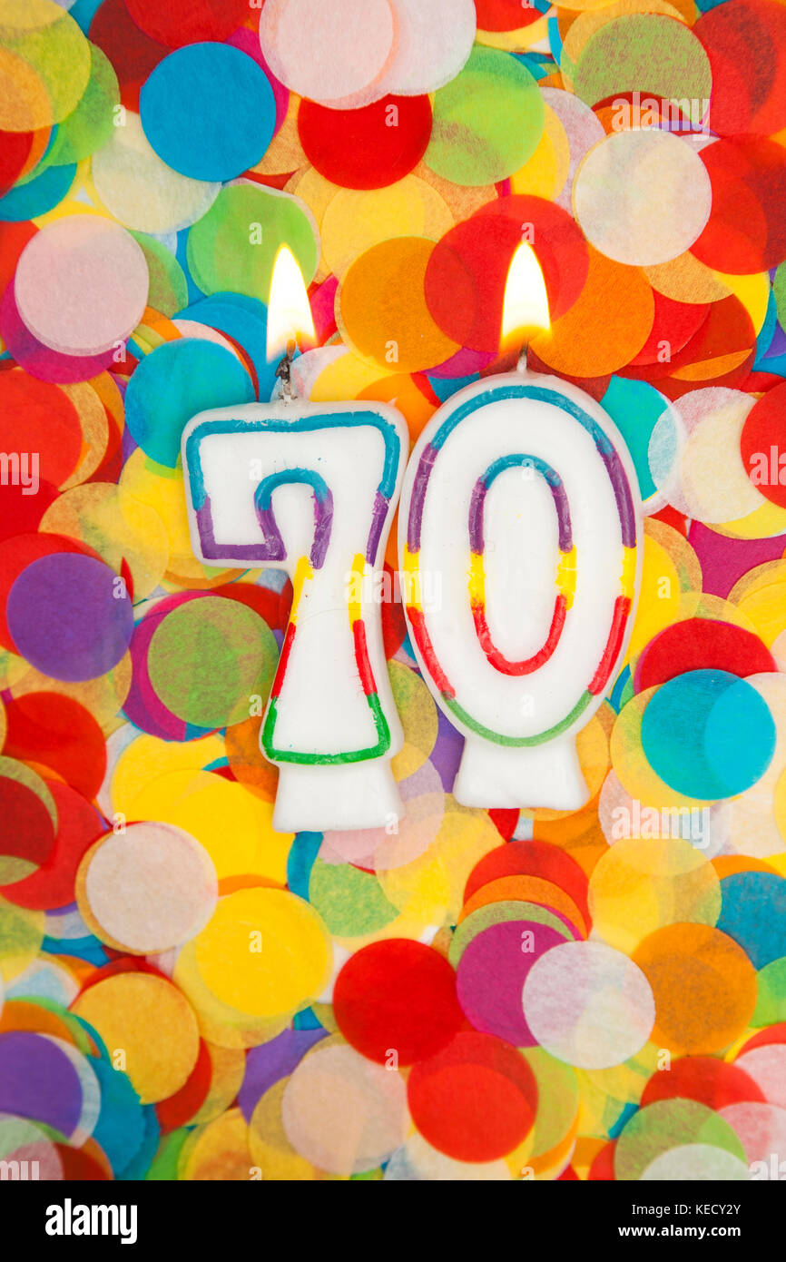 Celebration candle number 70 on a confetti background Stock Photo - Alamy