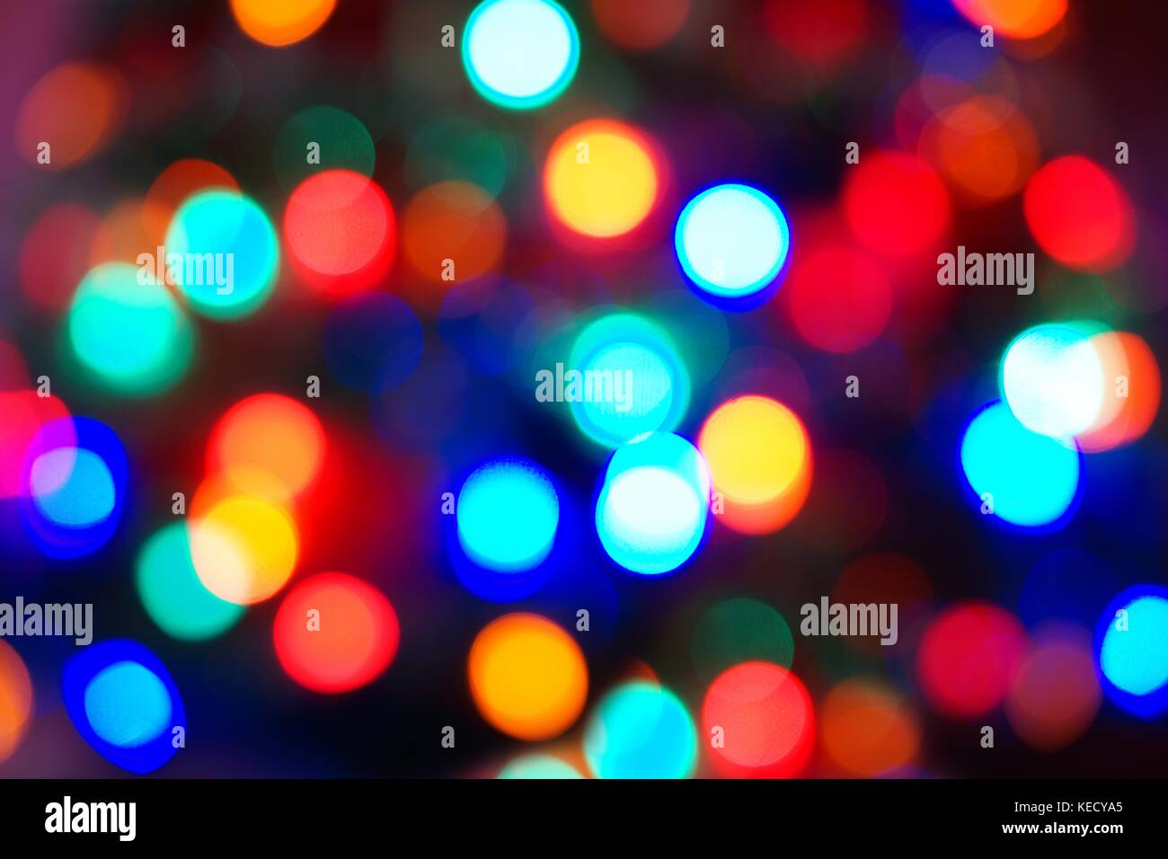 Defocused multi color Christmas light background Stock Photo
