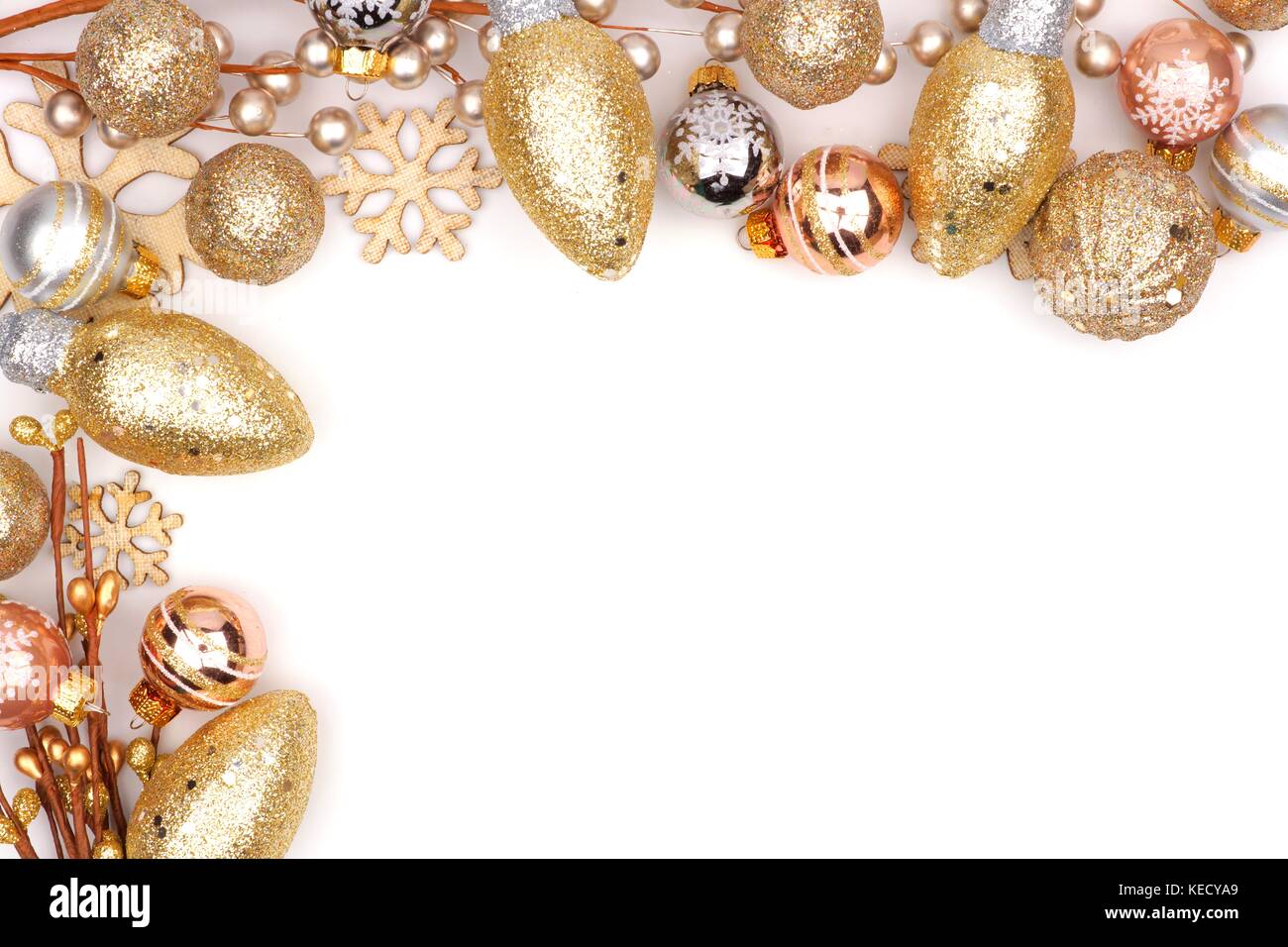 Christmas corner border of golden ornaments isolated on a white Stock