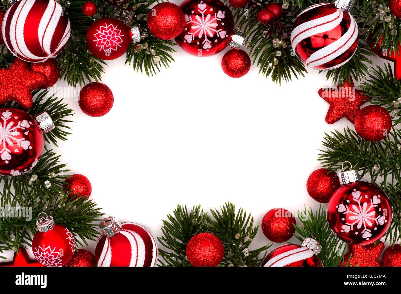 Christmas frame of red and white baubles with branches isolated on a white  background Stock Photo - Alamy