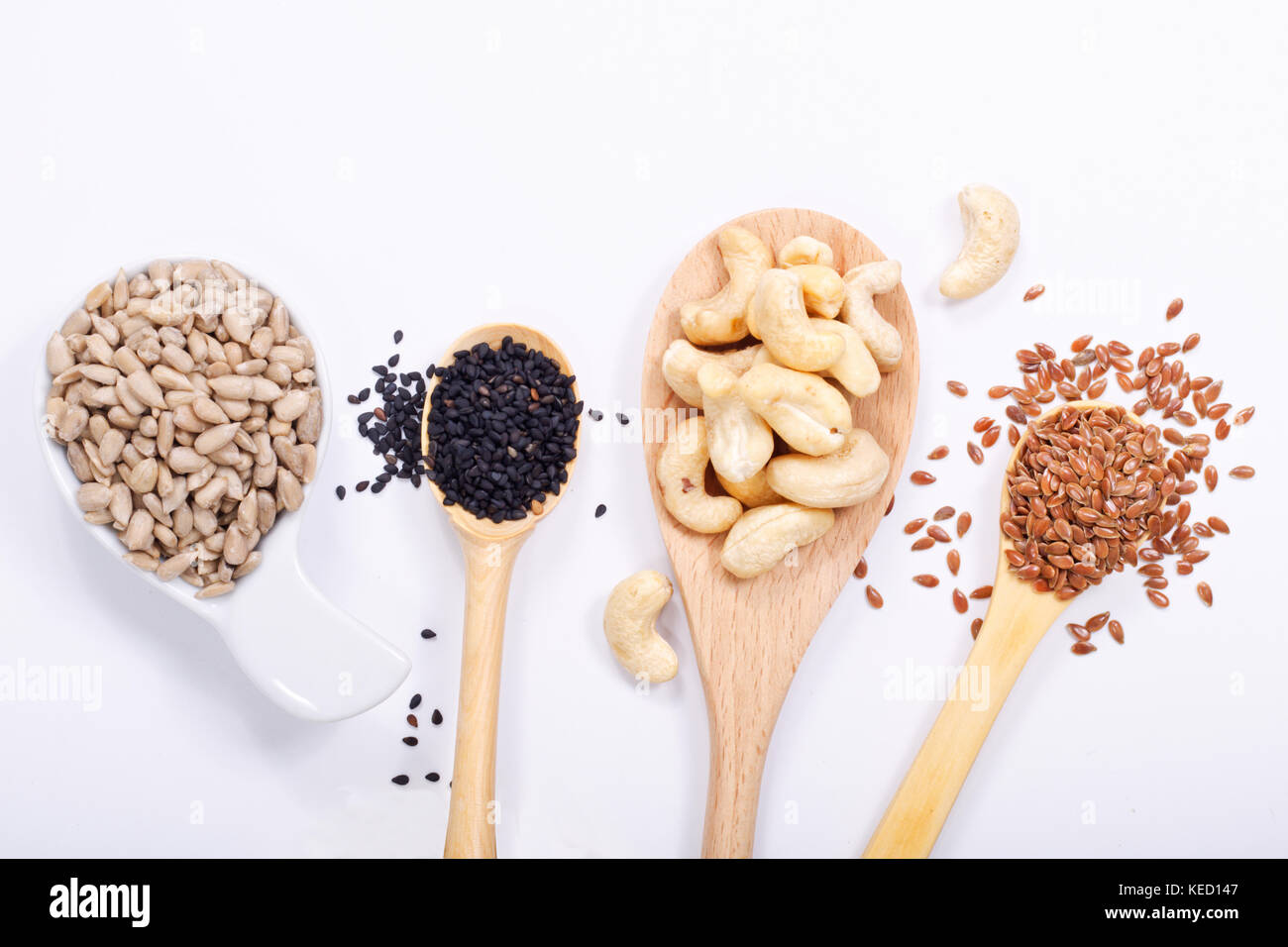 Healthy food concept top view sunflower seeds, cashew nuts, black