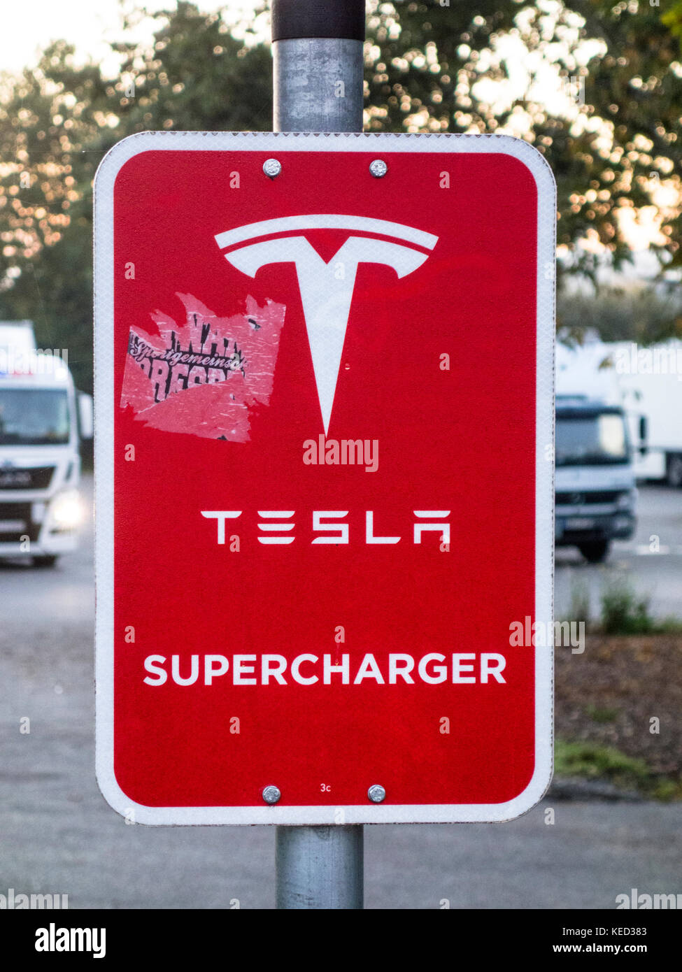 Tesla supercharger signboard at a petrol station in Bavaria, Southern Germany, October 2017 Stock Photo