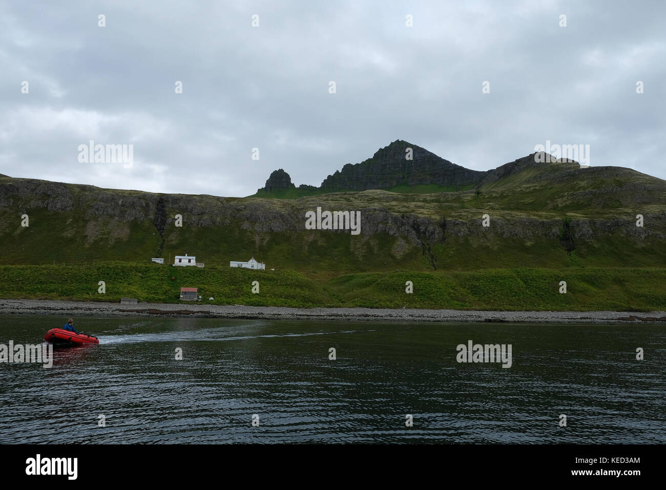 Landscape view of zodiac boat transporting tourists to holiday houses