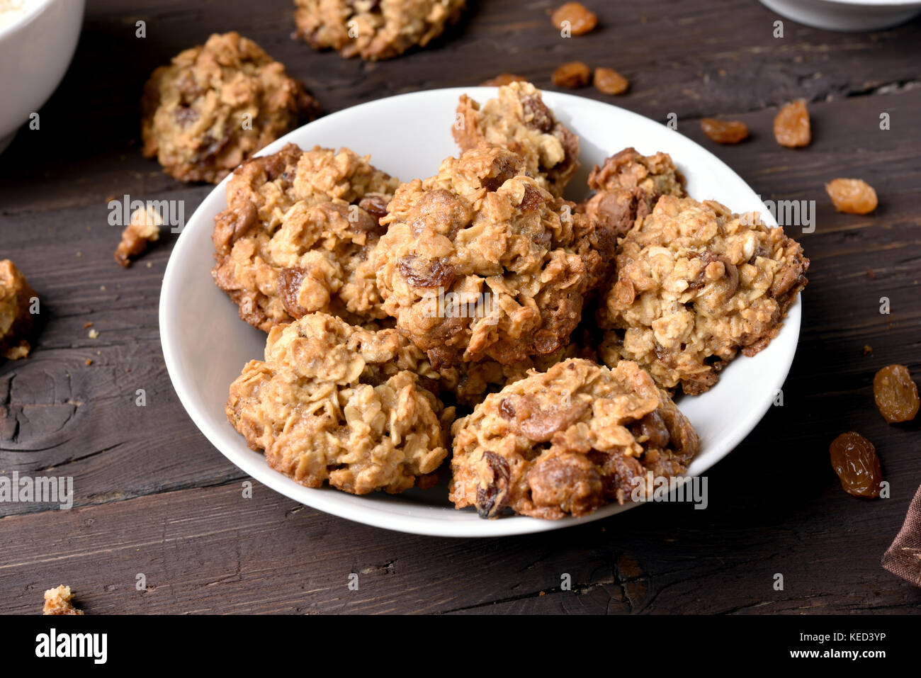 Tasty healthy oatmeal cookies with chocolate chips and raisin in plate