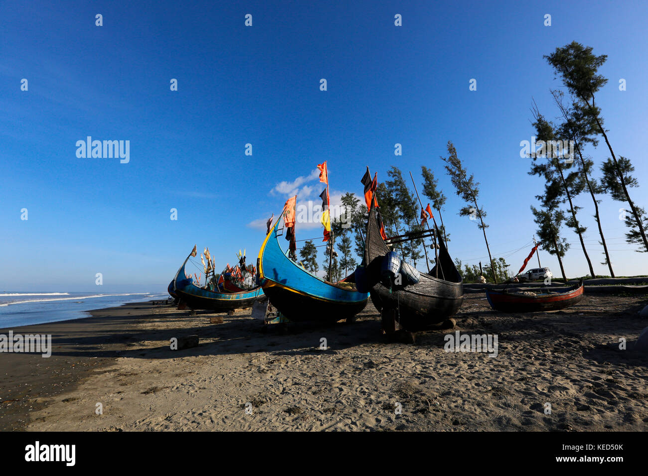 Fishing boats on Inani Sea Beach in Teknaf. It is a part of the Cox's Bazaar Sea Beach, the longest sea beach in the world. Teknaf, Cox´s Bazar, Bangl Stock Photo