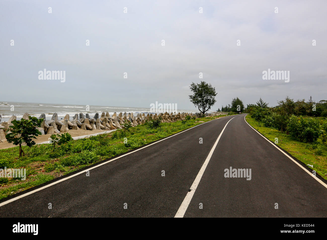 The marine drive road at Inani in Ukhia of Cox's Bazar. Cox’s Bazar–Tekhnaf Marine Drive is a 80-kilometre-long road from Cox’s Bazar to Teknaf along  Stock Photo
