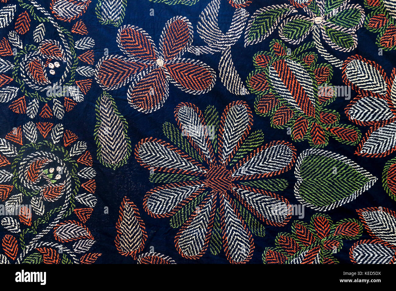 Nakskhi kantha, the embroidered quilt, treated as a piece of folk artistry for its rare beauty, colour and design. Jessore, Bangladesh. Stock Photo