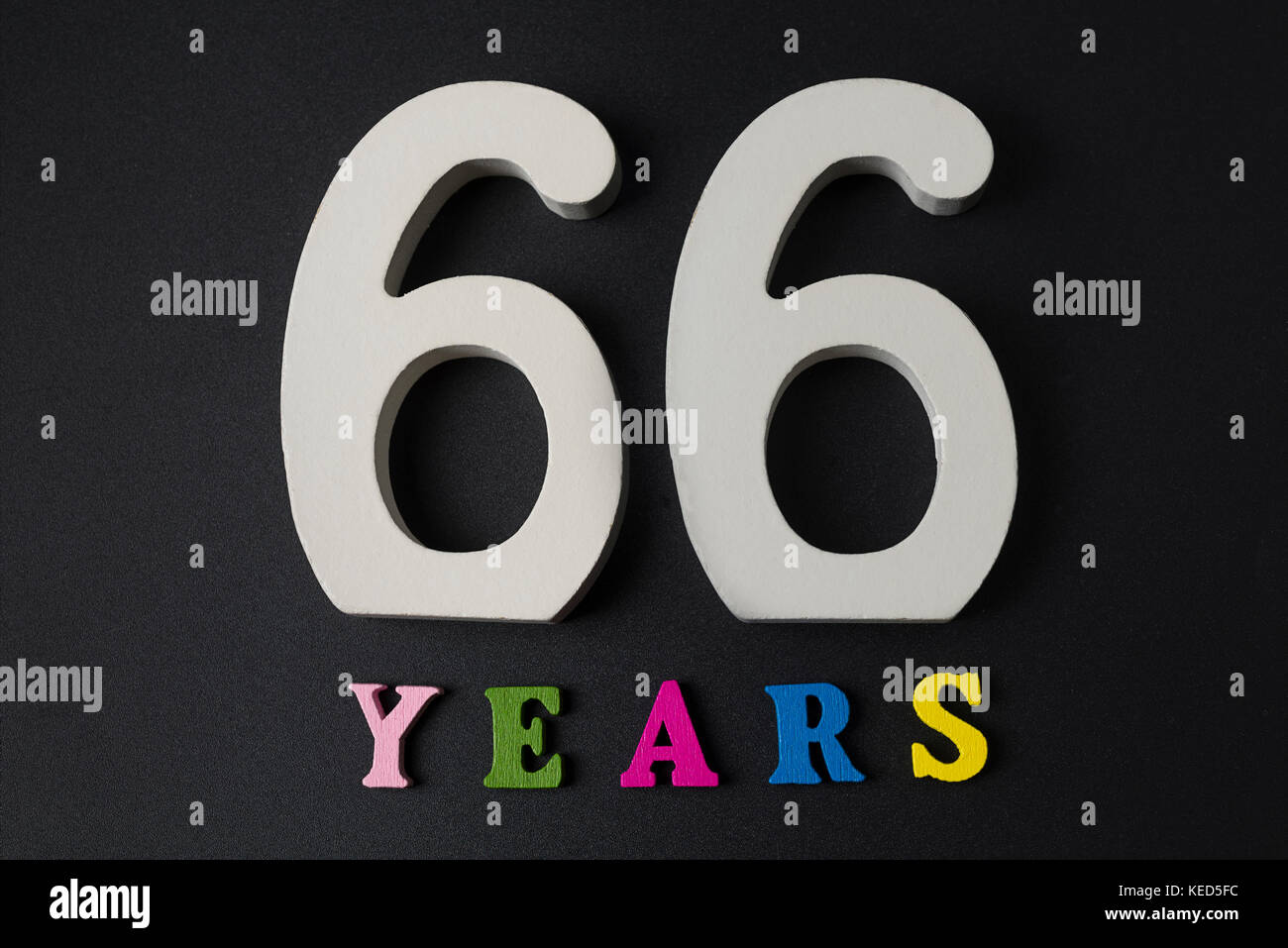 Letters and numbers sixtysix on a black isolated background Stock