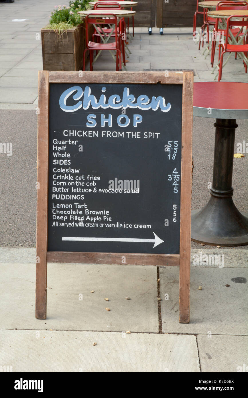 Menu board outside Chicken Shop restaurant in London England Stock