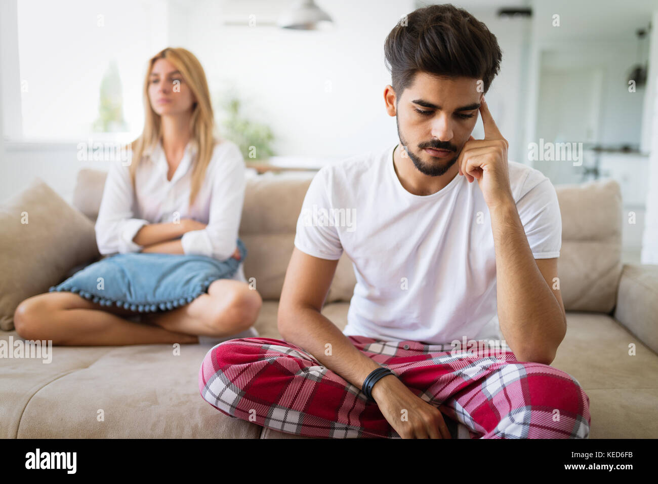 Unhappy couple having crisis and difficulties in relationship Stock Photo