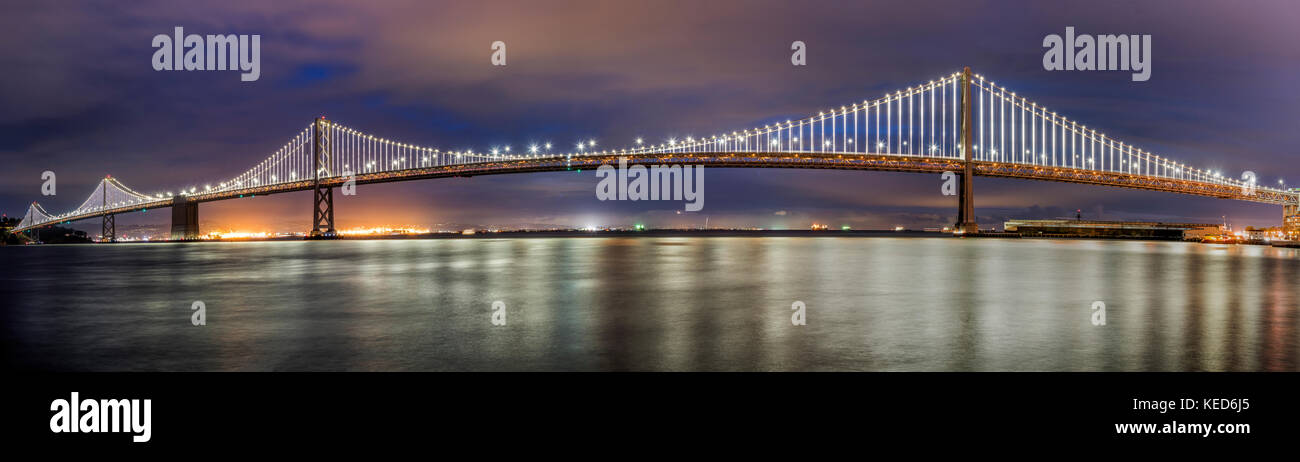 Panoramic night view of the the western section of the San Francisco-Oakland Bay Bridge, San Francisco, California, USA Stock Photo