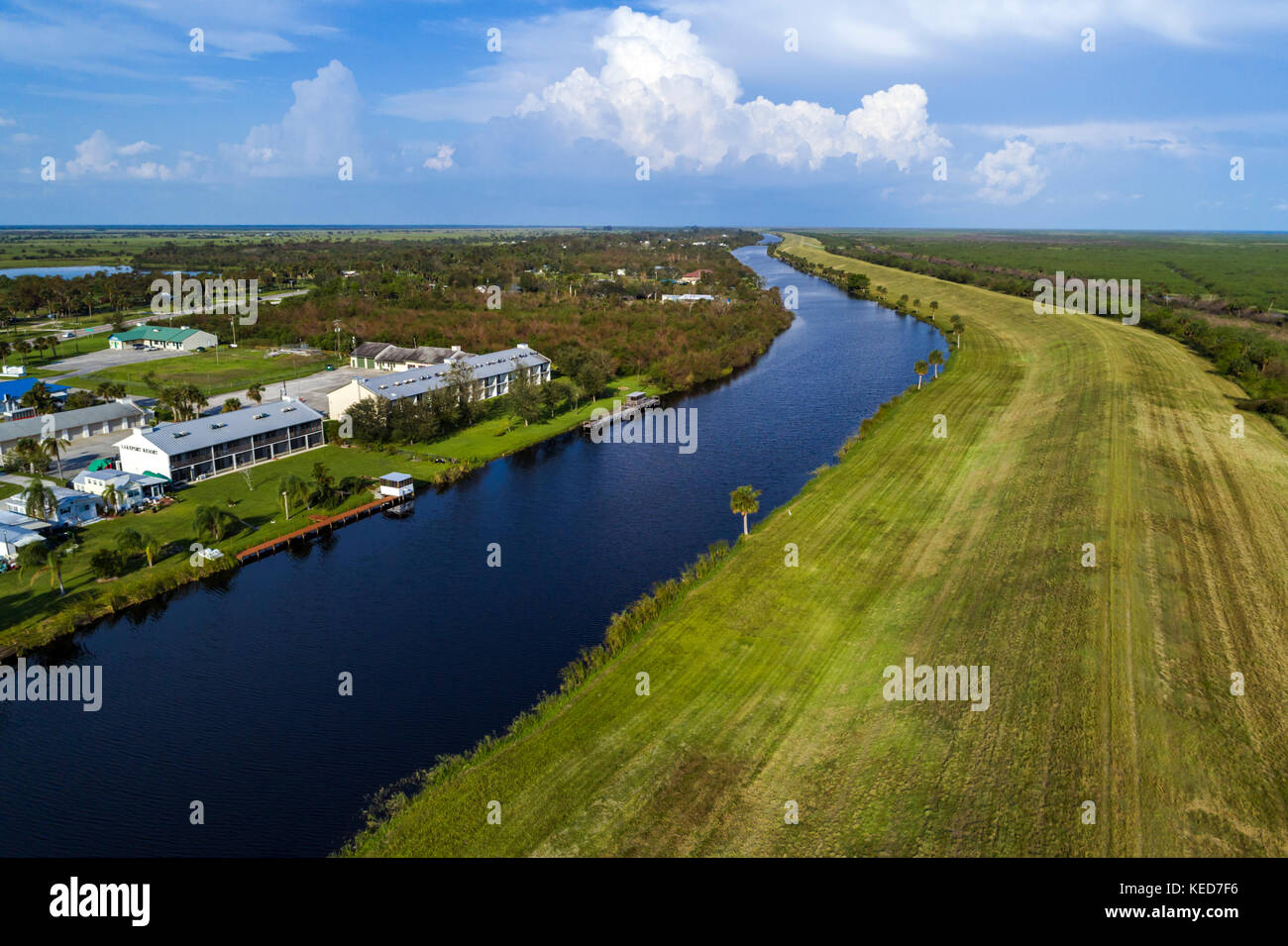 Florida Lakeport,water,canal,Lake Okeechobee levee Herbert Hoover dike,canal,Lakeport Motel & restaurant,aerial overhead view,FL17092835d Stock Photo