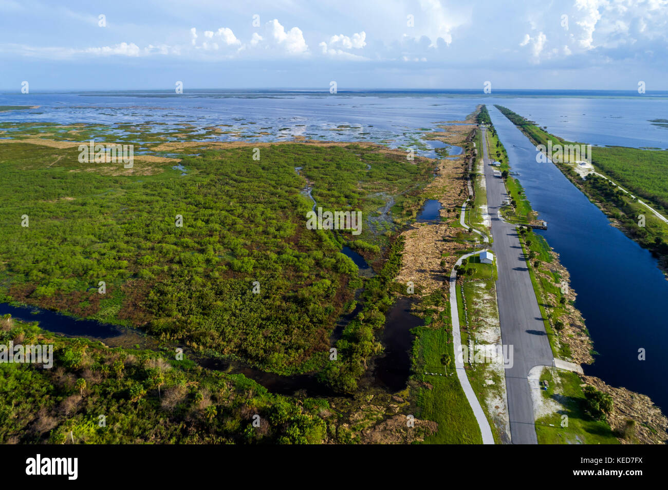 Florida Lakeport,water,canal,Lake Okeechobee levee Herbert Hoover dike,aerial overhead view,FL17092836d Stock Photo