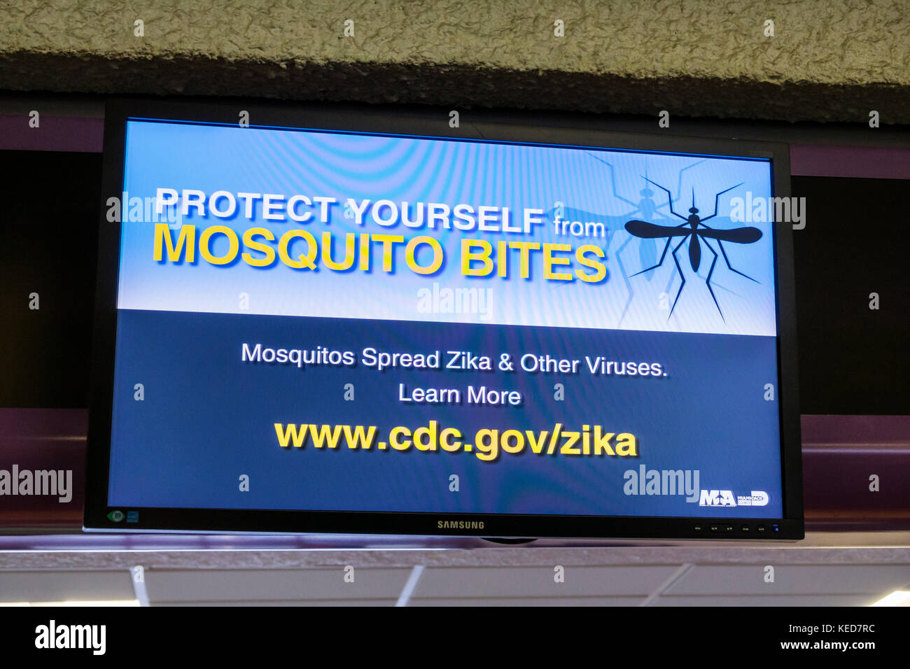 Miami Florida,MIA,Miami International Airport,terminal,information,health warning,digital display,Zika,prevention,mosquito bites,FL170628006 Stock Photo