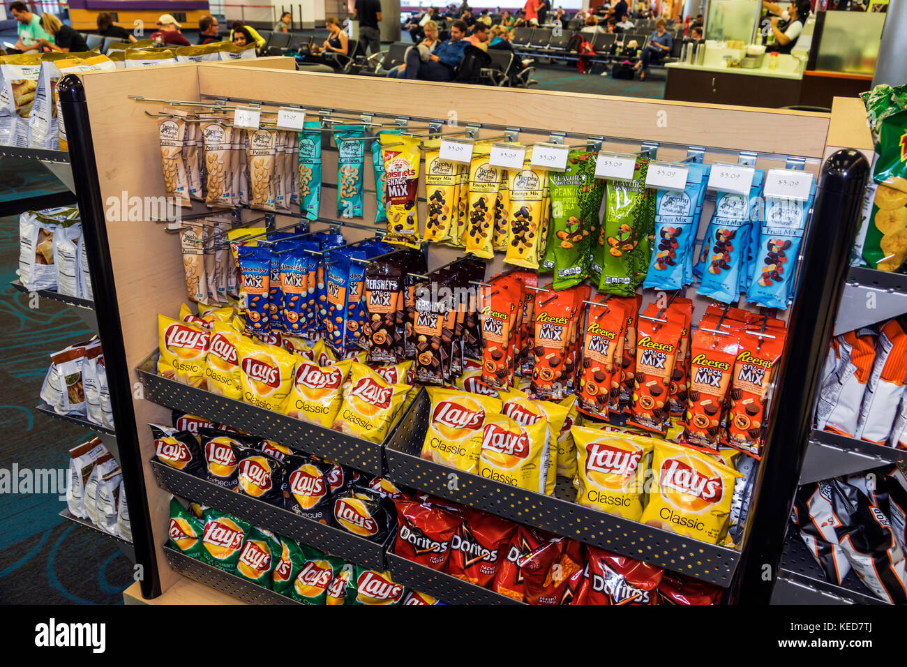 Florida,FL South,Miami,MIA,Miami International Airport,concession,sundries,snacks,potato chips,nuts,Lay's,brand,display,sale,junk food,visitors travel Stock Photo