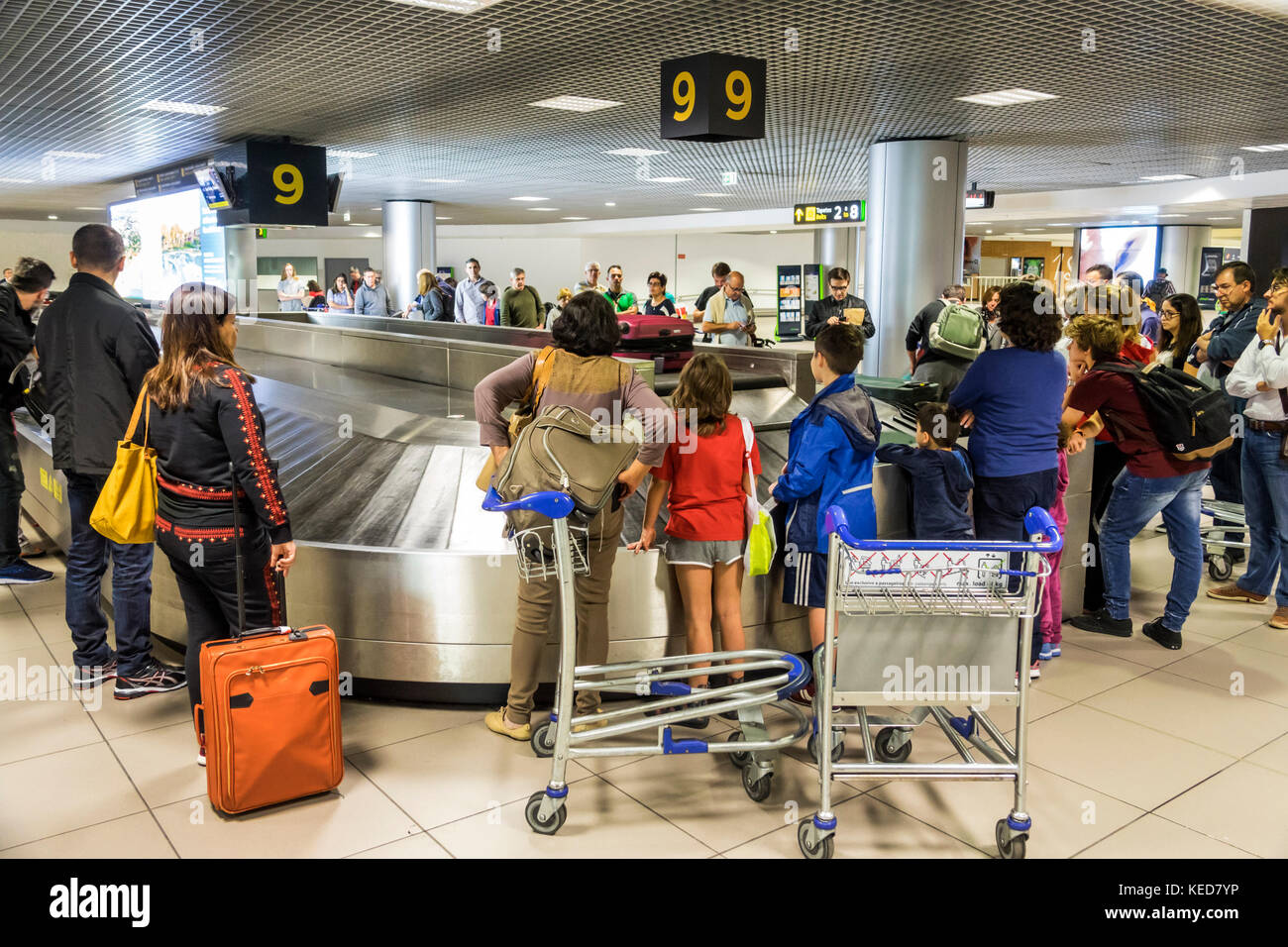 Lisbon Portugal,Humberto Delgado Airport,LIS,Portela Airport,baggage claim,carousel,luggage,passenger passengers rider riders,family families parent p Stock Photo