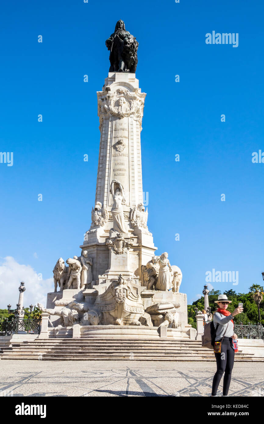 Lisbon Portugal,Marquis of Pombal Square,Marquess,monument,plaza,roundabout,rotunda,monument,statue,woman female women,picture,selfie,smartphone cell Stock Photo