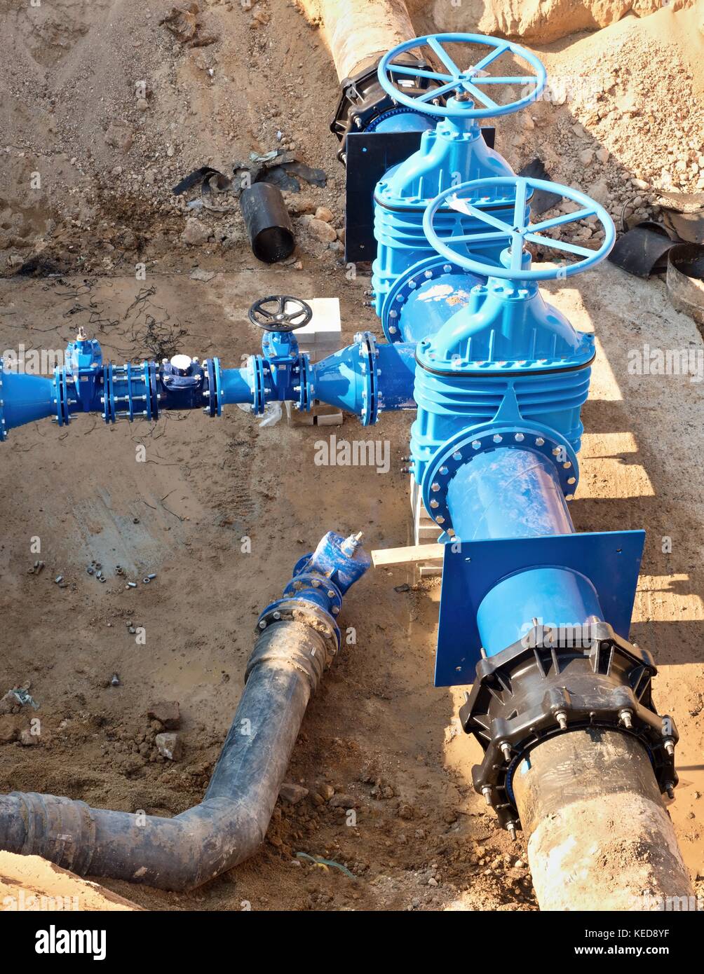 Oil, gas, water industry. Wellhead with valve armature underground. Dug