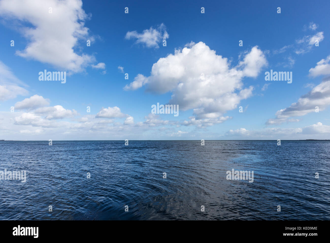 Beautiful sea under cloudy blue sky, background Stock Photo - Alamy