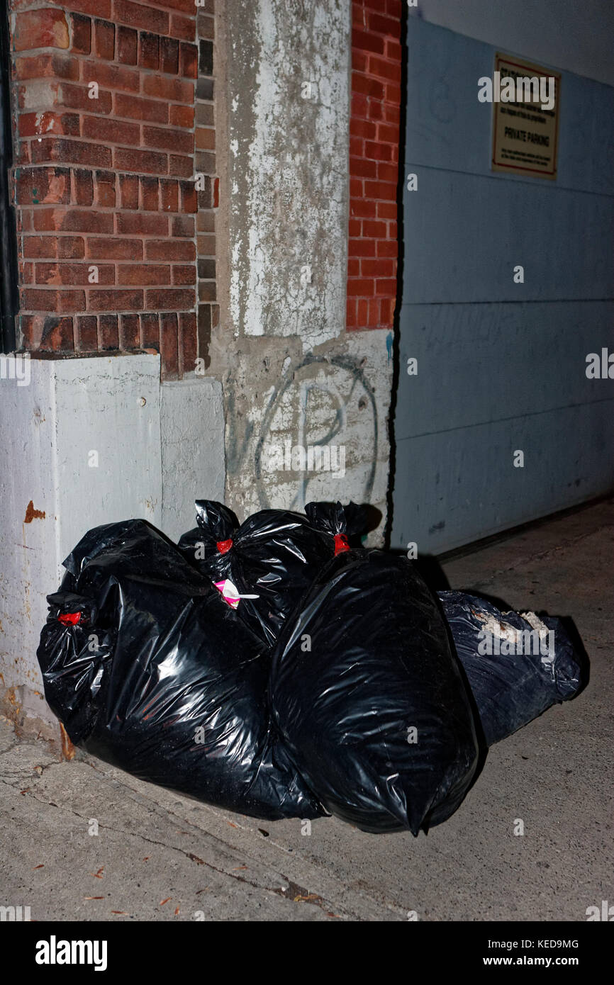 Quebec,Canada. Curbside garbage bags in the city of Montreal Stock