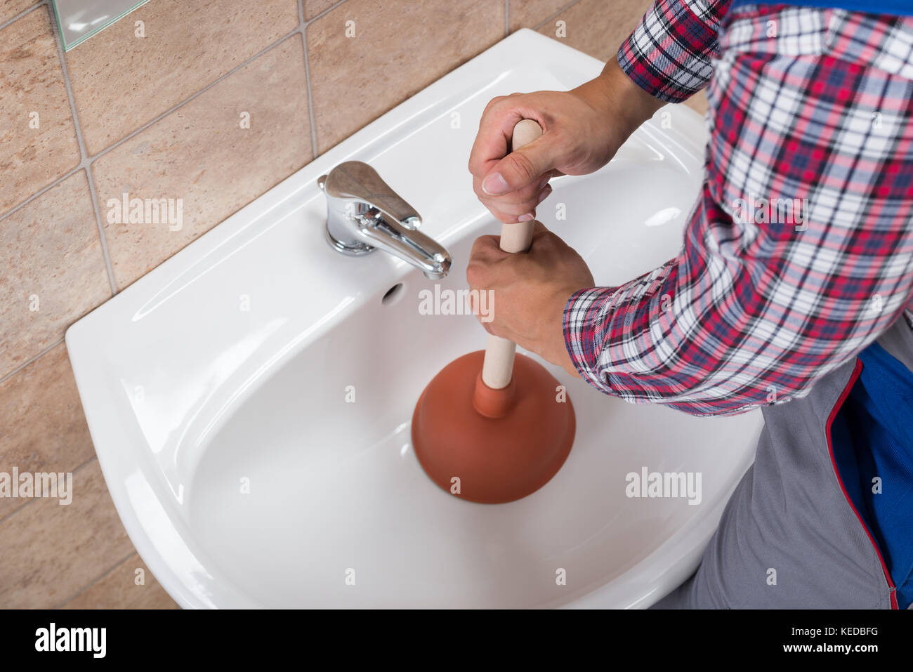 Close-up of Plumbers Using Plunger in Bathroom Sink. Stock Image - Image of  sink, plumbing: 236937845