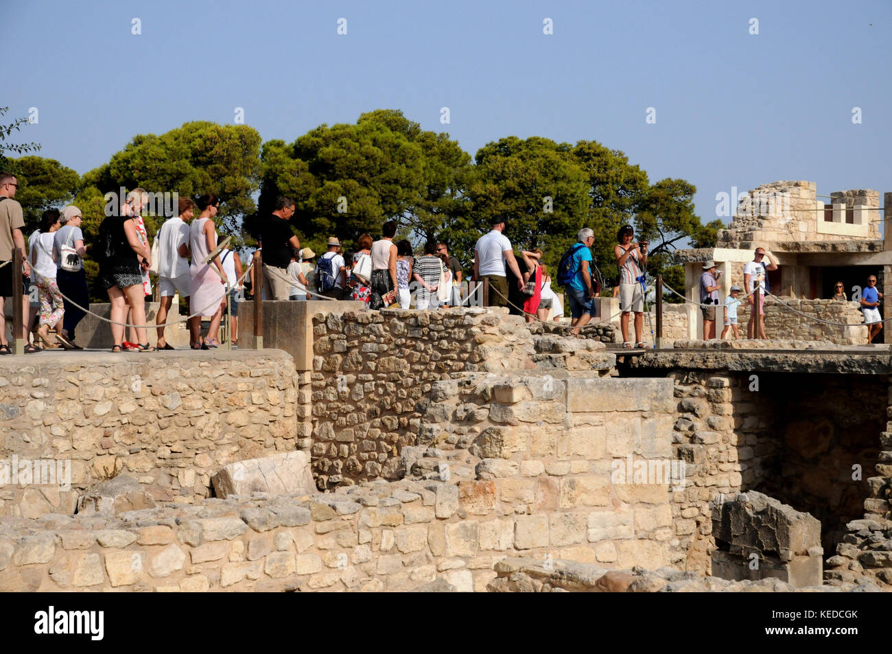 Visitors, many from tours and cruise ships, crowd into the Palace at Knossos on the Island of Crete. Interested in history or just a site to tick off? Stock Photo
