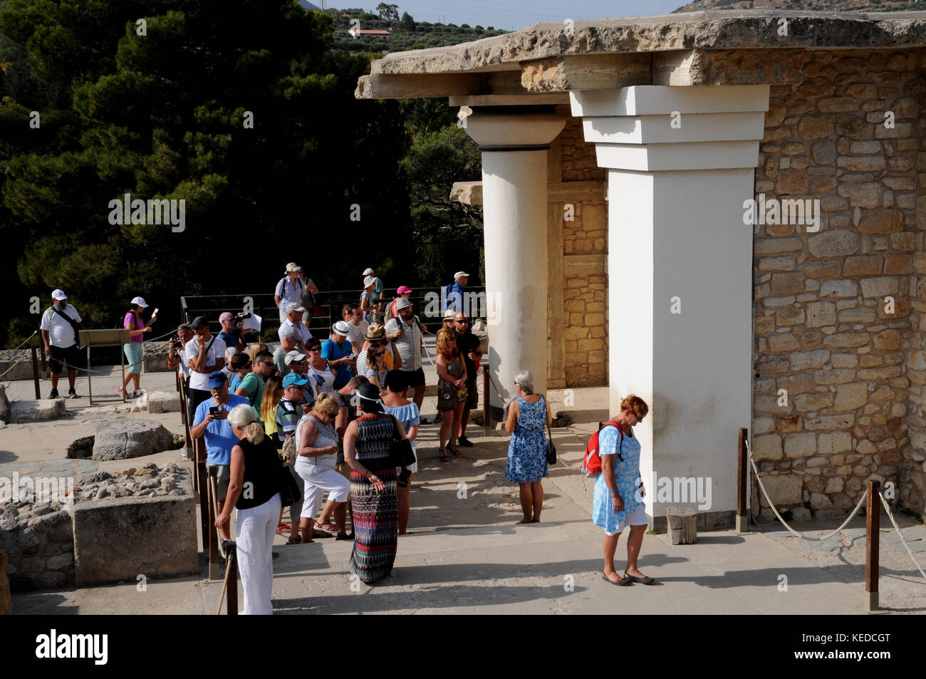 Visitors, many from tours and cruise ships, crowd into the Palace at Knossos on the Island of Crete. Interested in history or just a site to tick off? Stock Photo