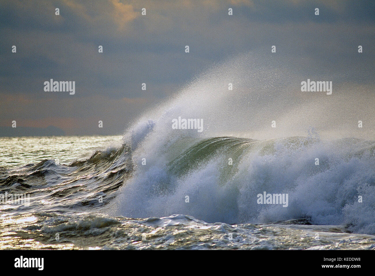Scenic. Stormy sky over the Atlantic ocean with large wave breaking. Stock Photo