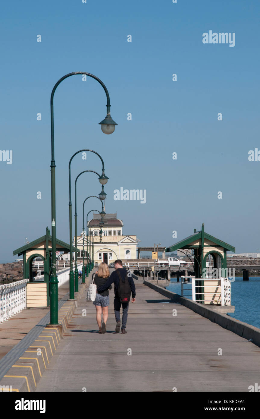 Strollers on the St Kilda Pier, heading towards the Kiosk rebuilt after the disastrous 2003 fire, Melbourne, Australia Stock Photo