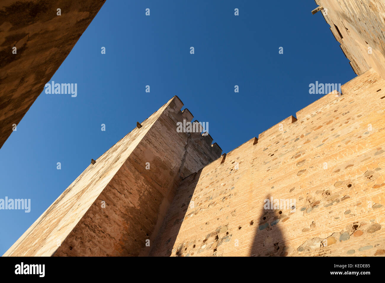 Granada, Spain: The Alhambra Palace and Fortress. Plaza de Armas at the Alcazaba fortress. The two towers, Torre del Homenaje and Torre Quebrada, serv Stock Photo