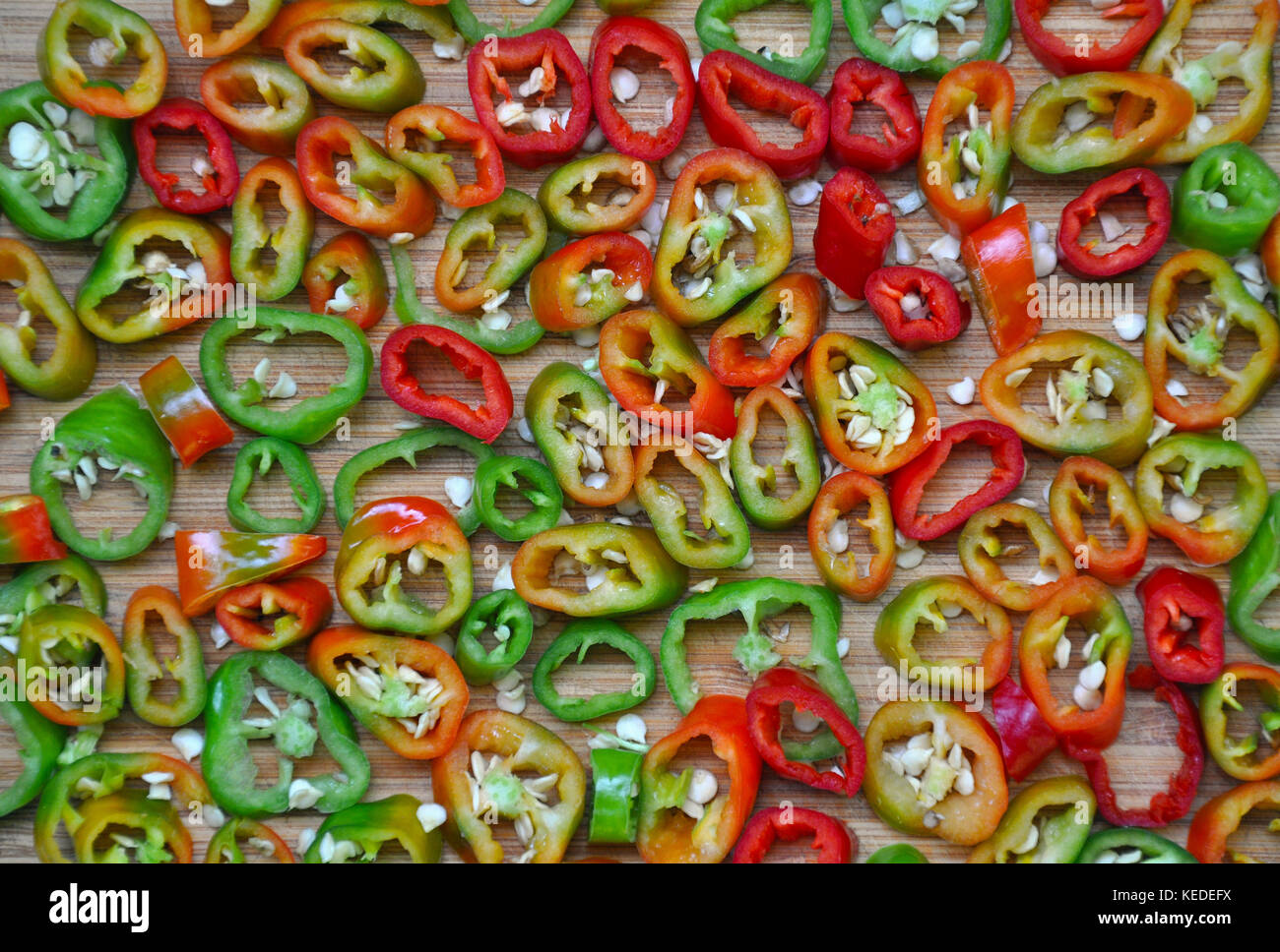 Fresh sliced red and green hot peppers Stock Photo - Alamy