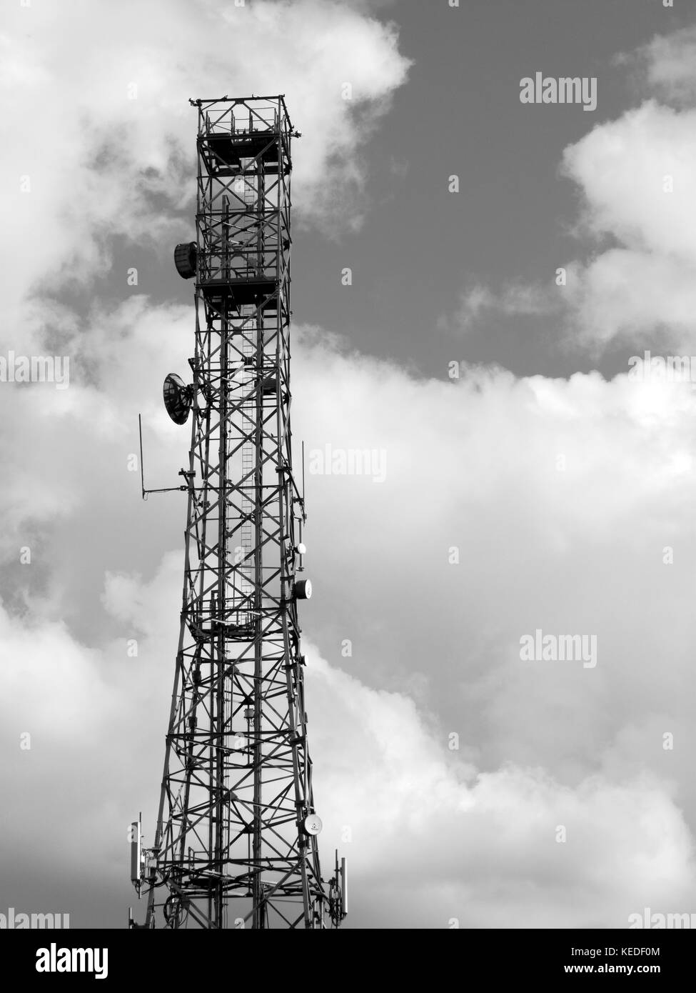 Mobile telephone communications base station tower sited on farmland Stock Photo