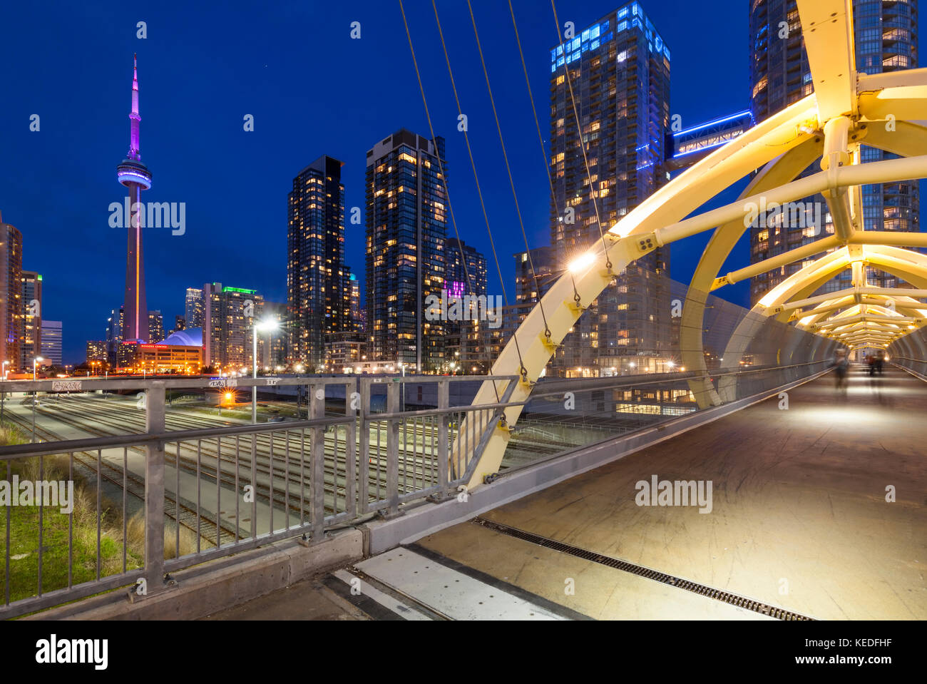 The Puente de Luz (bridge of light) bridge designed by Francisco Gazitua that connects Concord CityPlace to Front St with the Toronto skyline. Stock Photo
