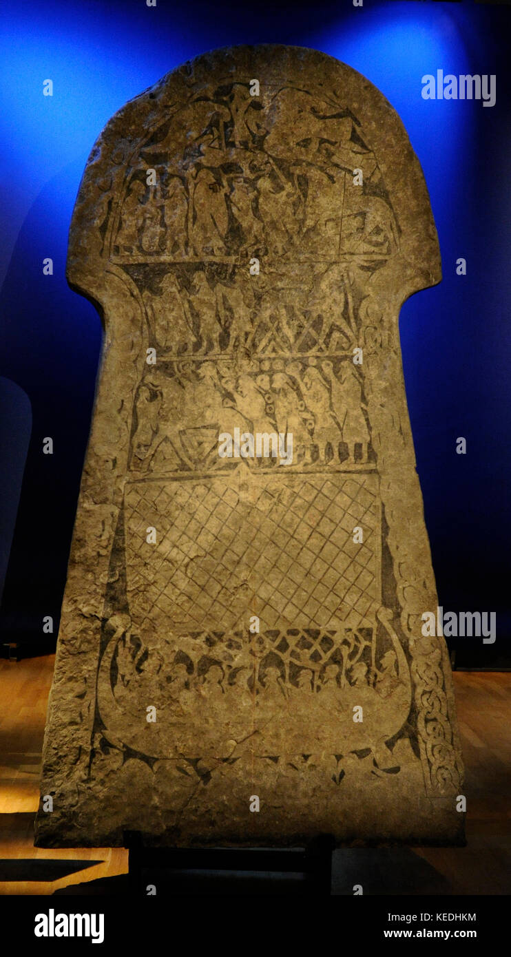 Tangelgarda stone. Larbro, Gotland, Sweden. Decorated with scenes holding ring (possibly Odin) horsed, with Valknut symbols drawn beneath. 7th century. Swedish History Museum. Stockholm, Sweden. Stock Photo