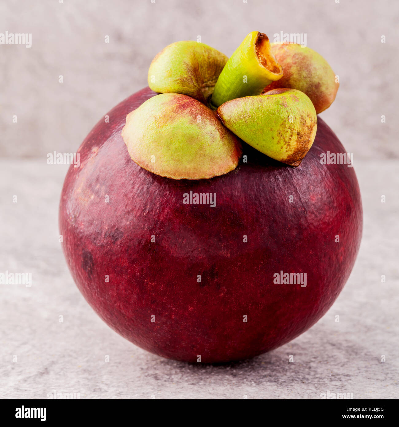 Delicious mangosteen fruit arranged on stone background.Mangosteen the queen of thai fruits