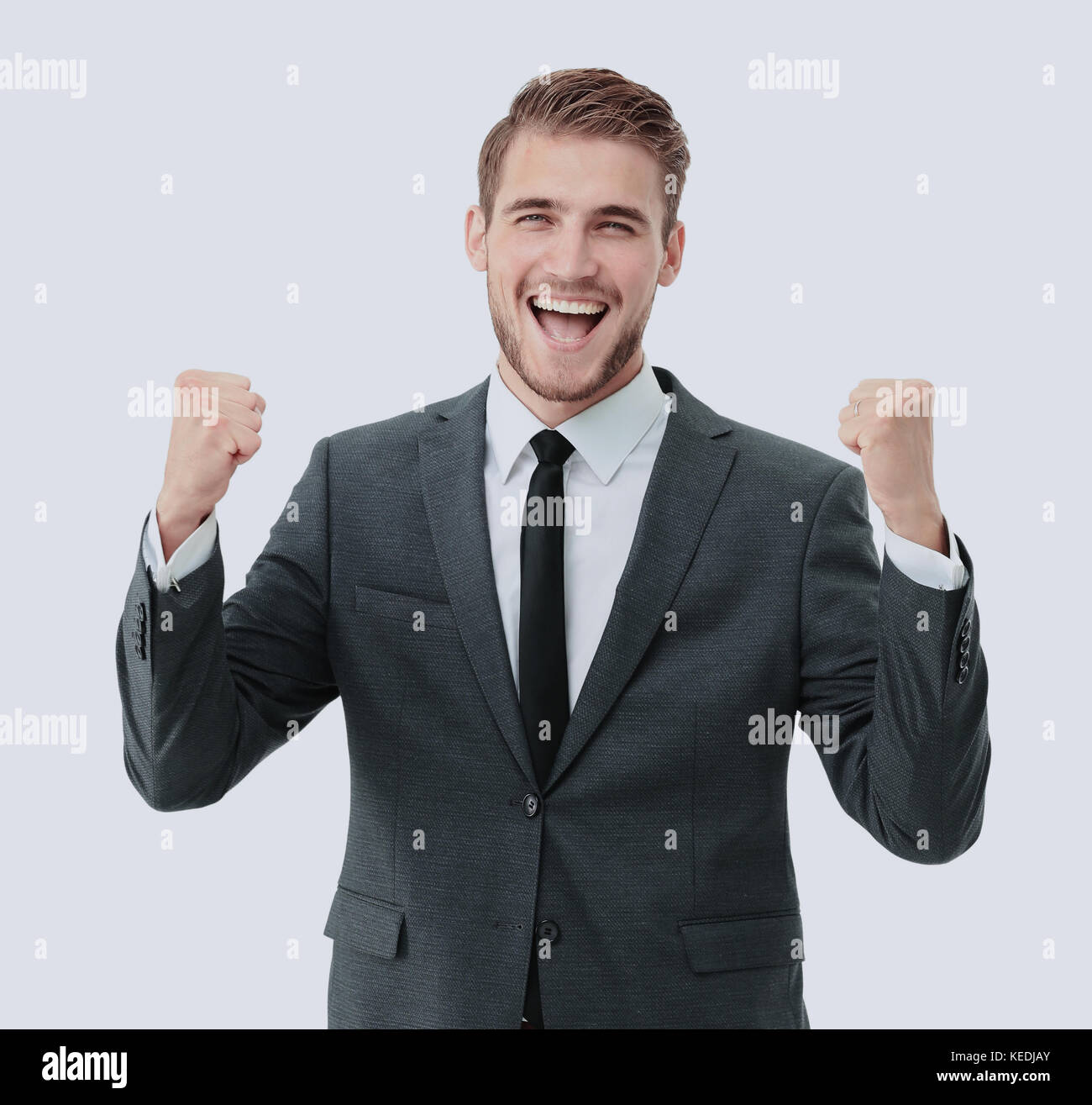 Businessman celebrating with his fists raised in the air and a Stock ...