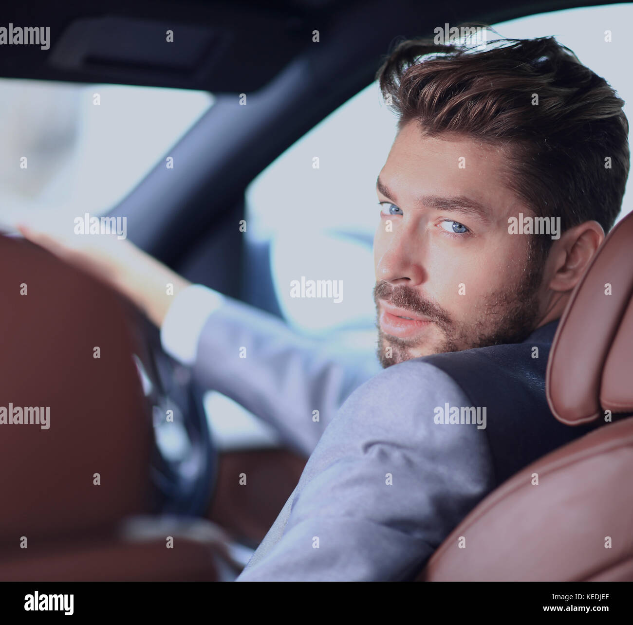 Portrait of an handsome smiling business man driving his car Stock ...