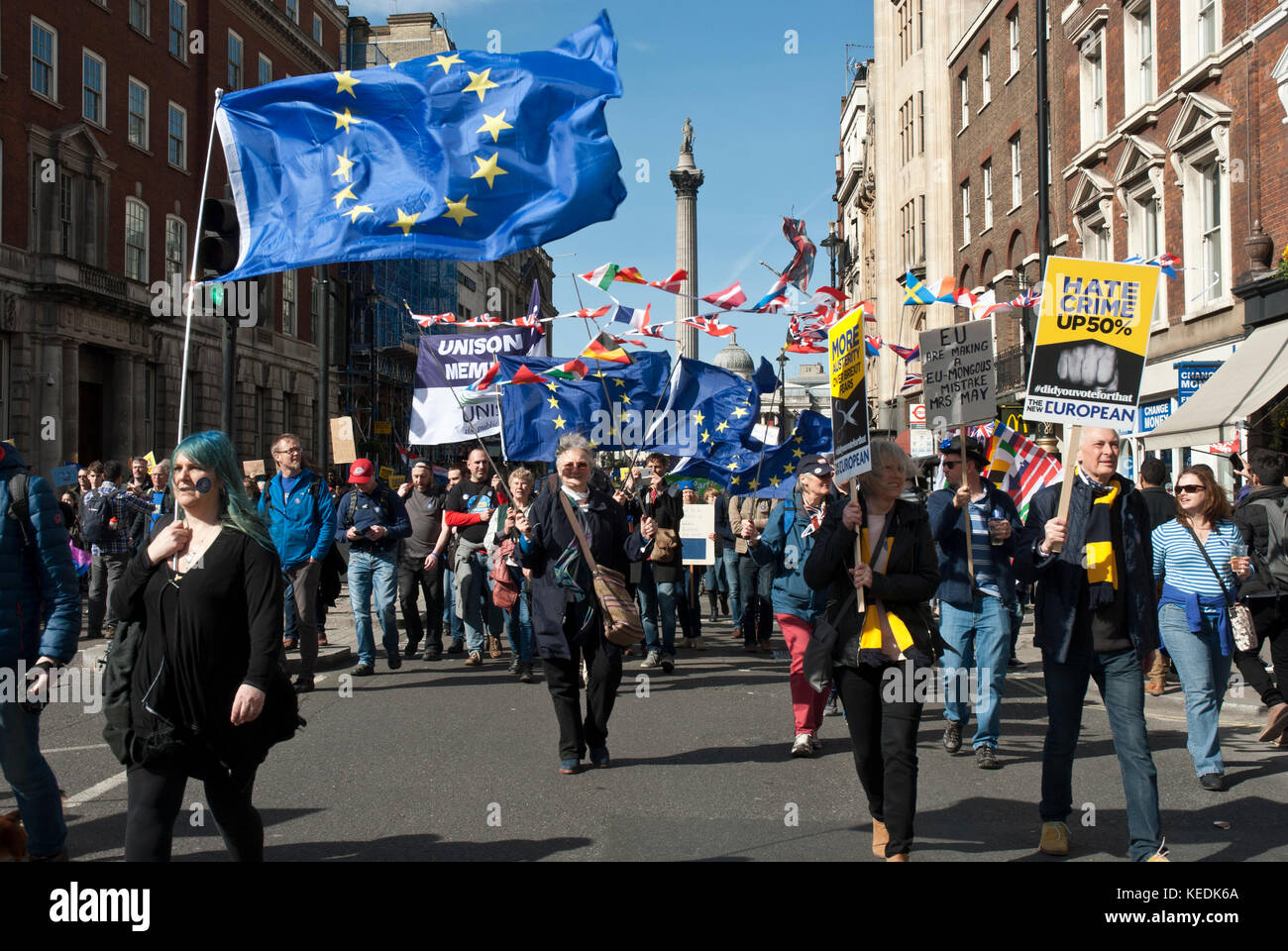 Demonstration in support of Remain/EU with many blue EU flag and poster 'Hate crime up 50% '(since Brexit vote) Stock Photo