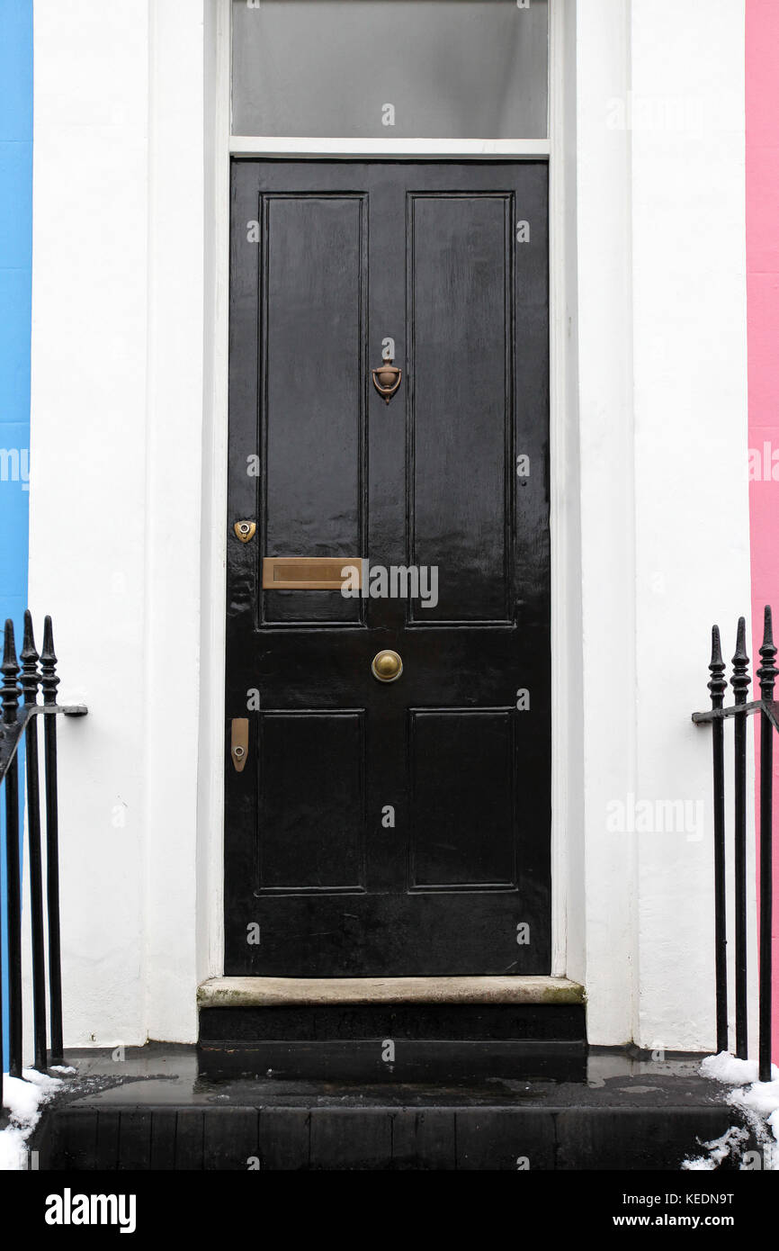 Black entrance door on retro residential house Stock Photo - Alamy