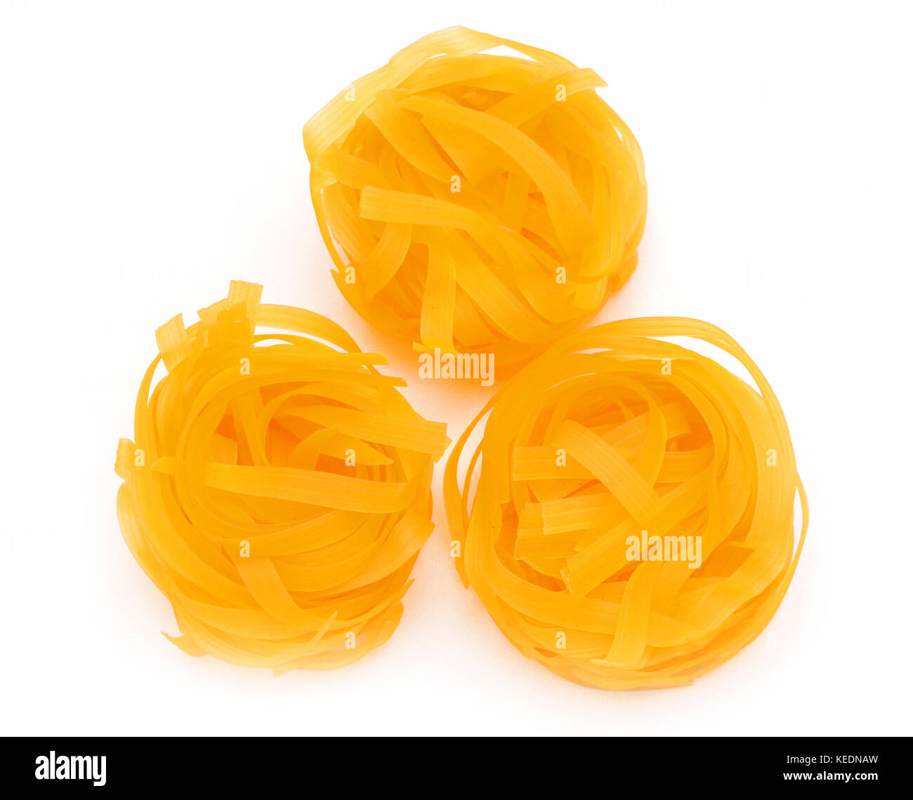 Fresh traditional italian dry pasta tagliatelle nests Stock Photo Alamy