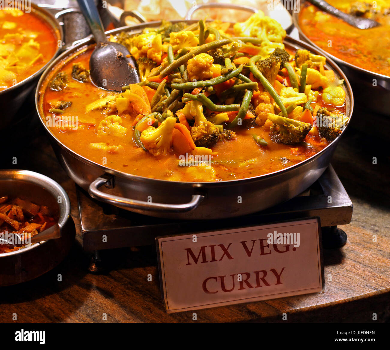 Mix vegetables curry sold as fast food on market Stock Photo