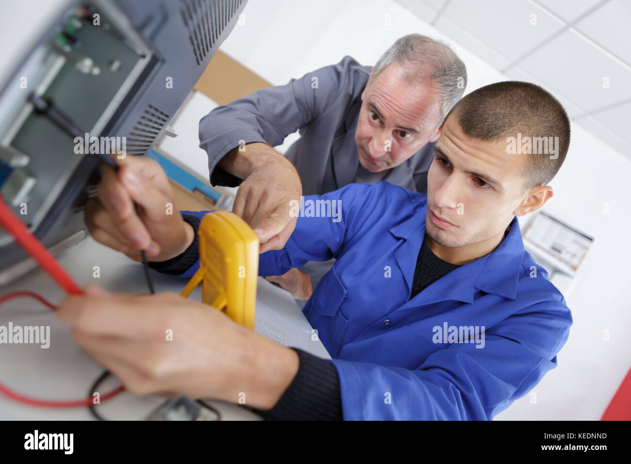 apprentice calibrating printer Stock Photo Alamy