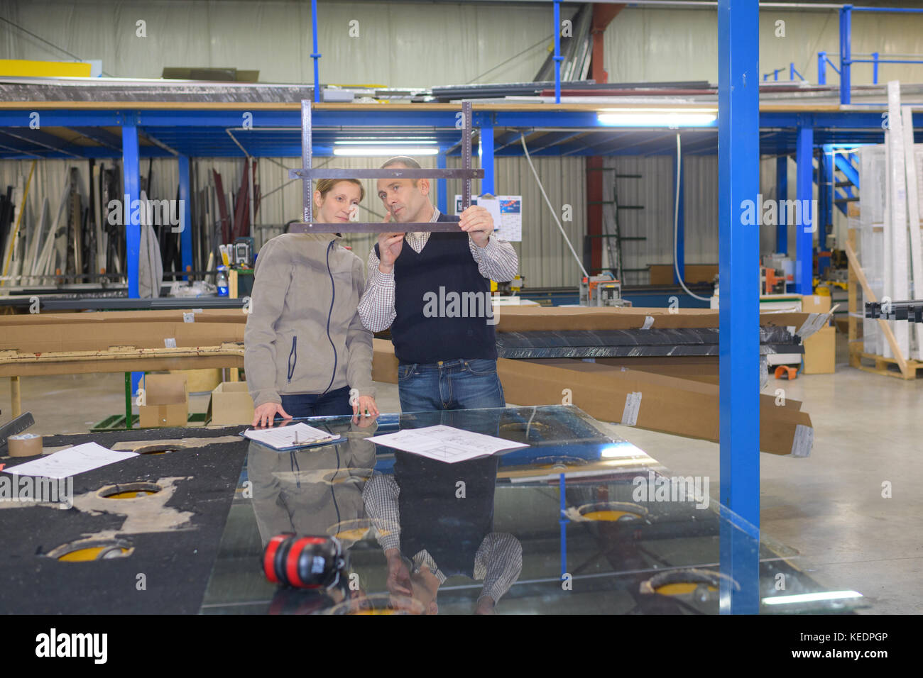 two worker in factory on work bench Stock Photo - Alamy