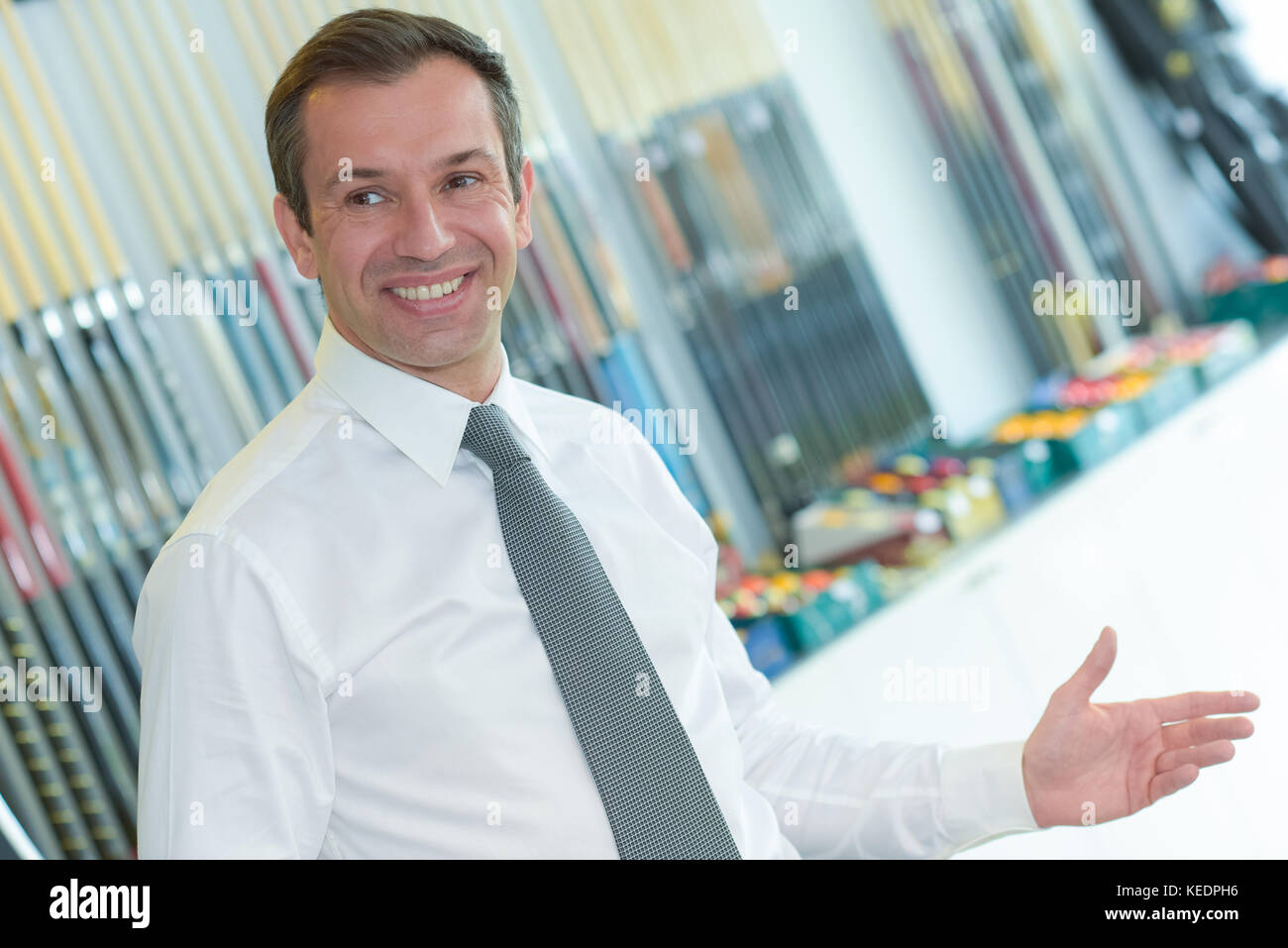 portrait of happy businessman standing in office Stock Photo - Alamy