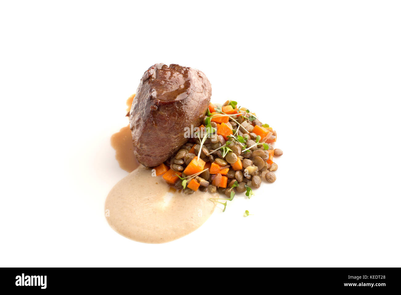 Fillet mignon with lentil and sauce isolate Stock Photo
