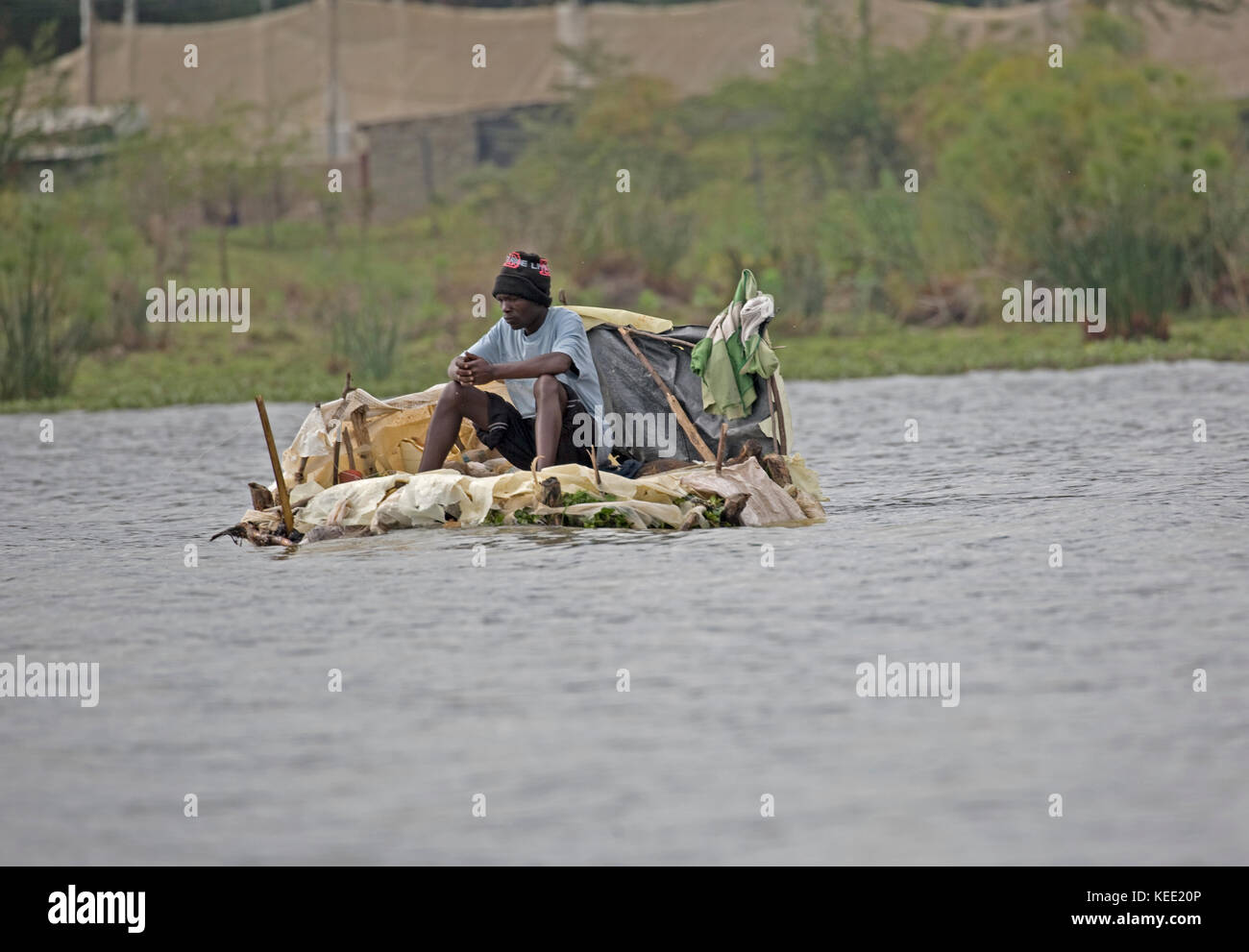 Local fishermen fishing from floating plastic platforms Lake